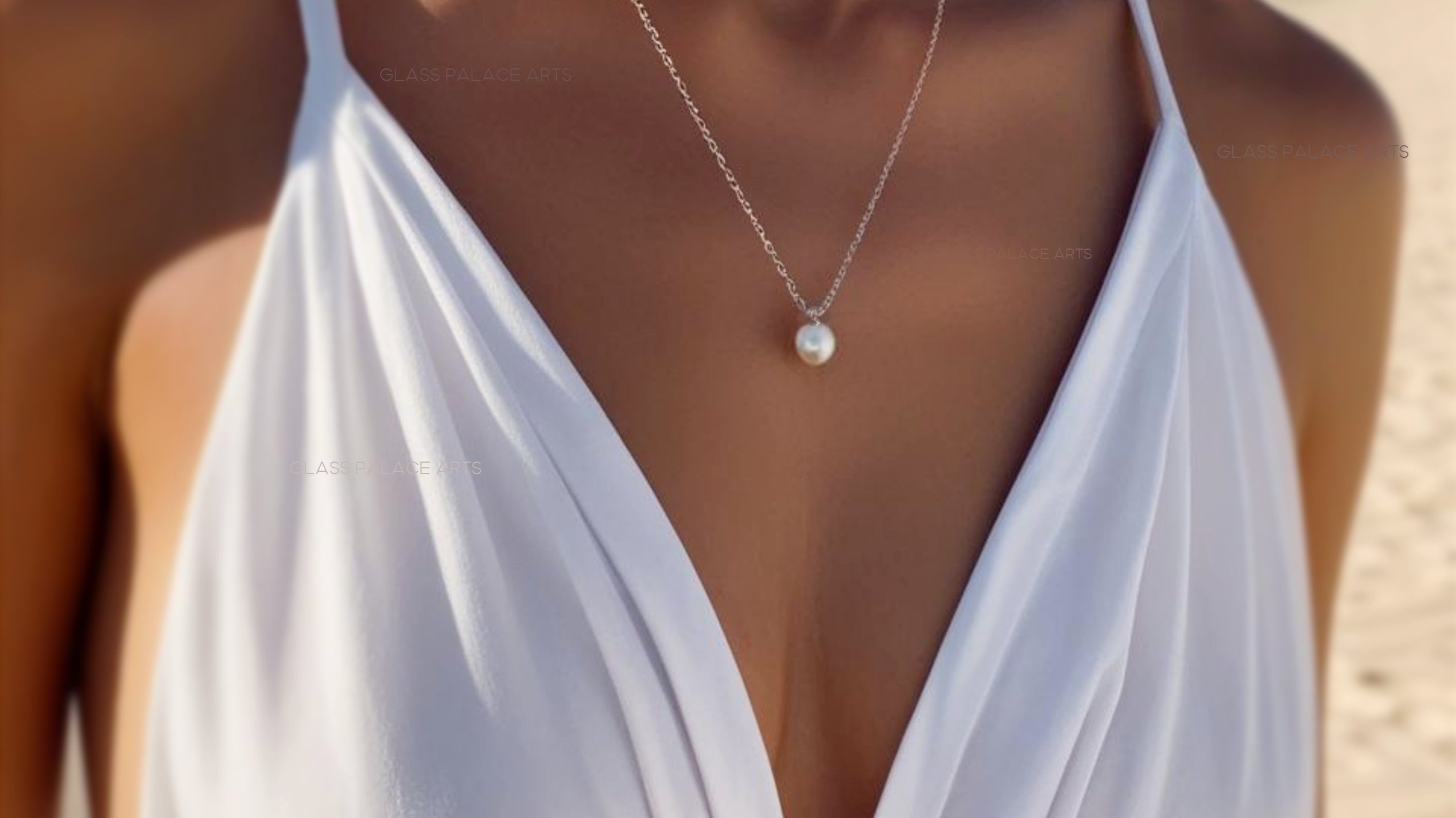 everything you need to know about pearls - woman wearing classic pearl necklace