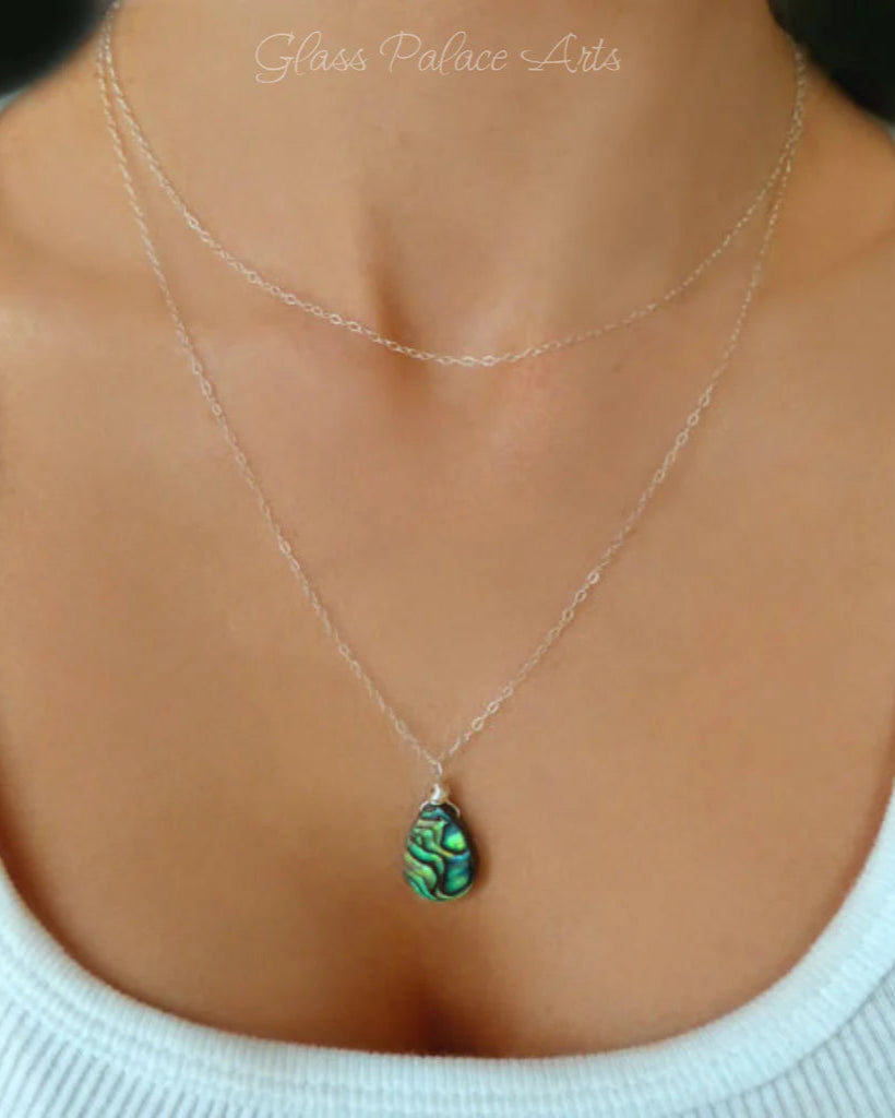 abalone layered multi strand pendant necklace on woman