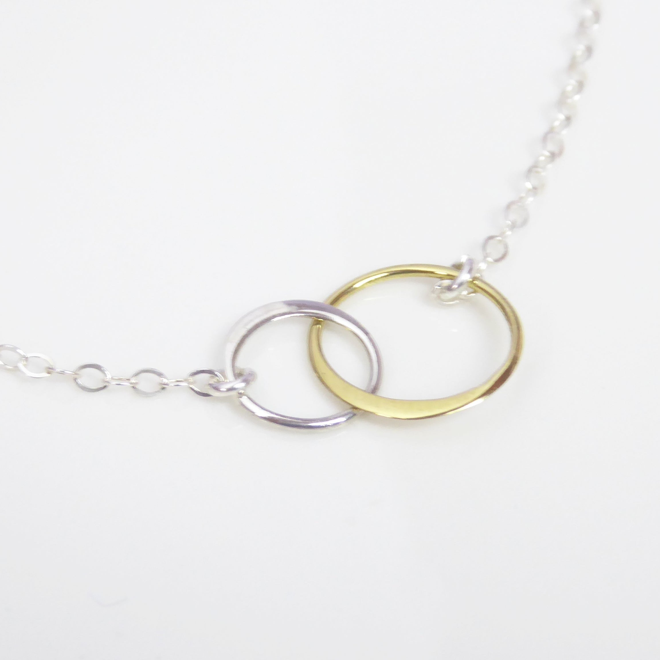 Mixed Metal Infinity Necklace With Interlocking Circles