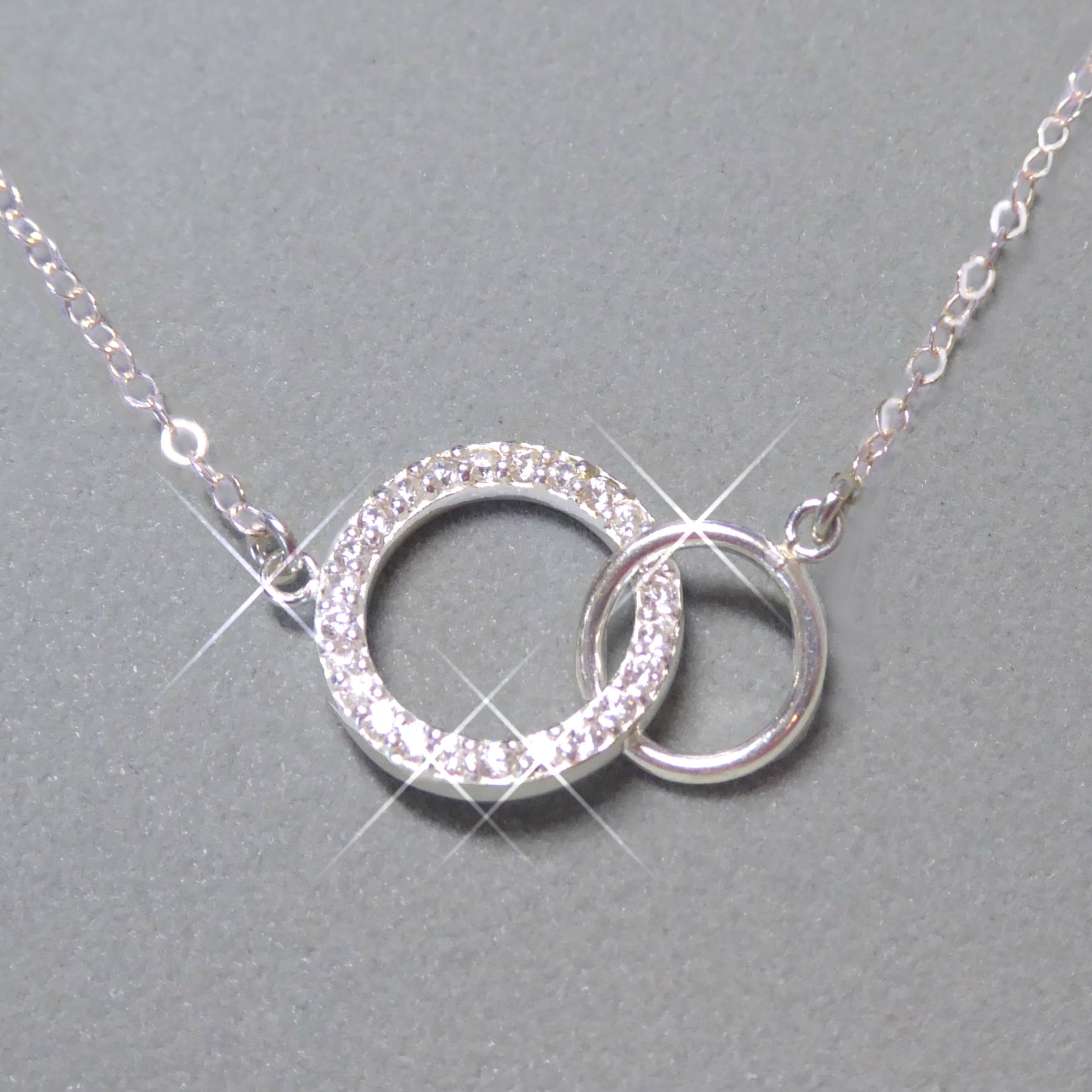 Sterling Silver Cubic Zirconia Infinity Necklace With Interlocking Circles and Pave' Stones