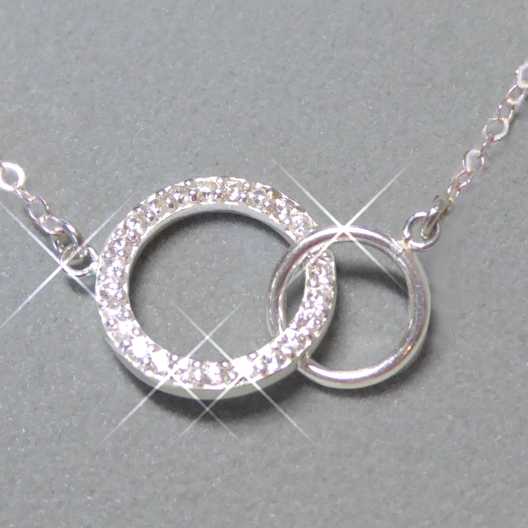 Sterling Silver Cubic Zirconia Infinity Necklace With Interlocking Circles and Pave' Stones