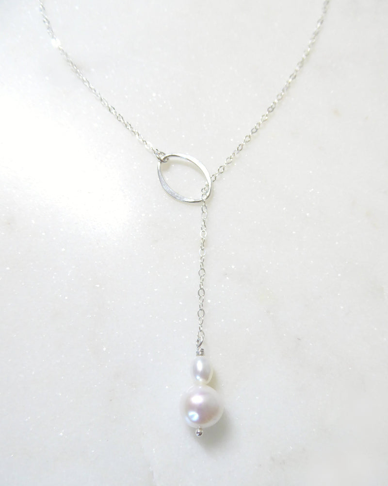 Pearl necklace on a white background