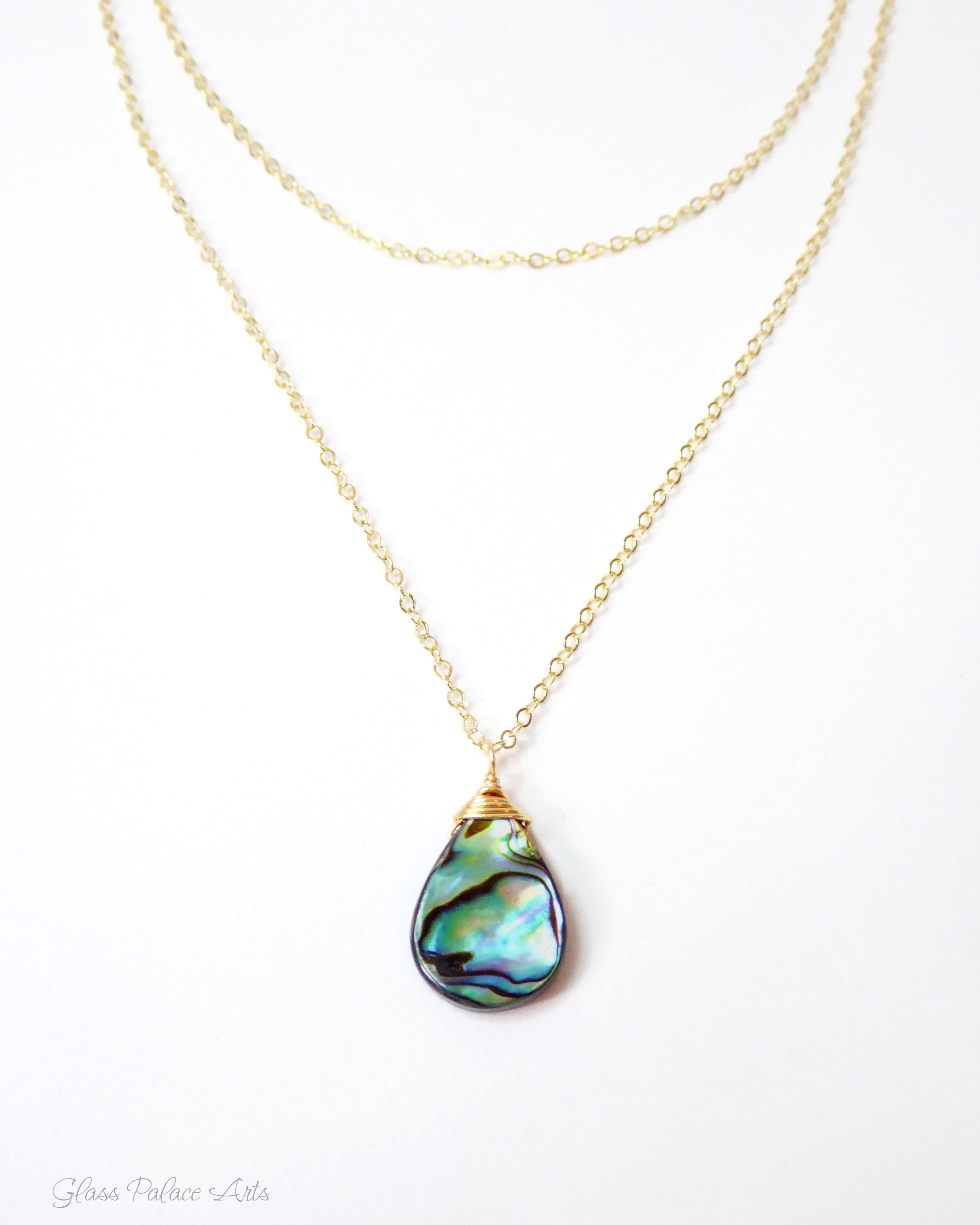 abalone layered multi strand pendant necklace on woman