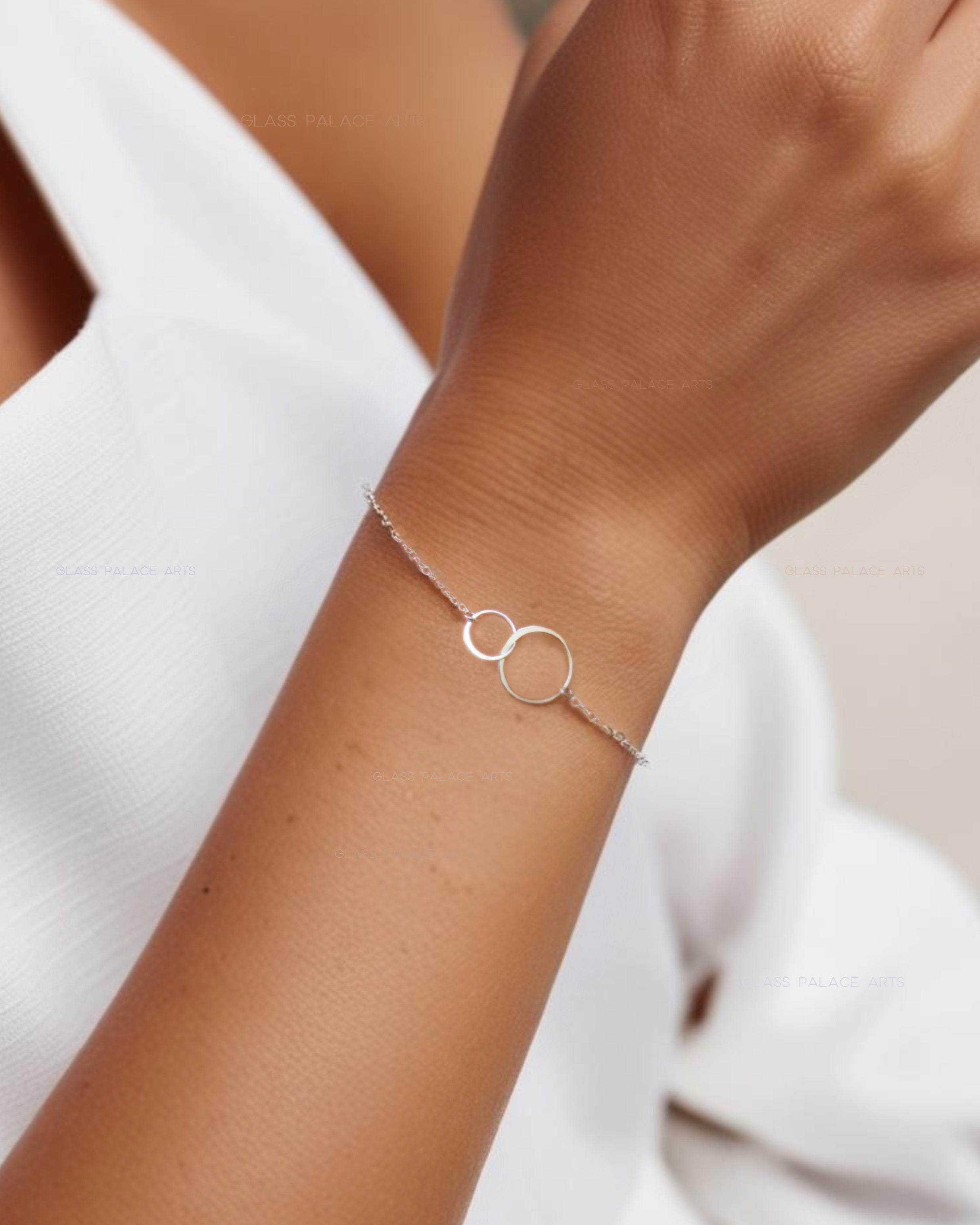 small silver infinity bracelet with two interlocking circles 