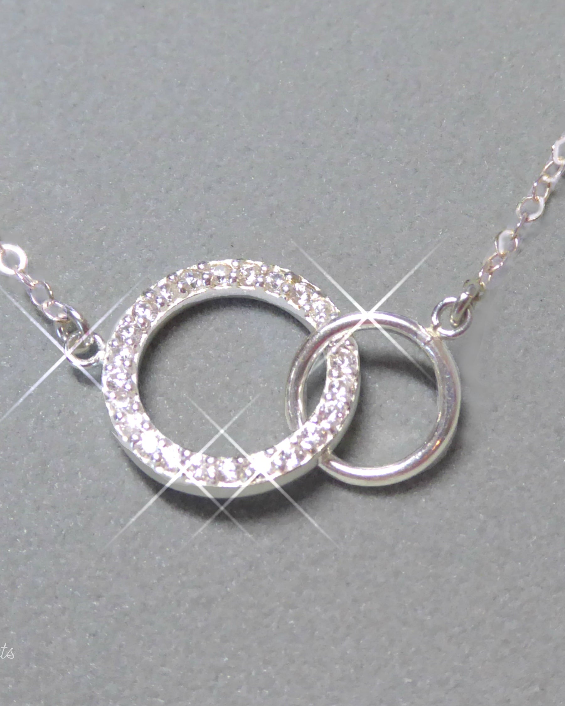 Sterling Silver Cubic Zirconia Infinity Necklace With Interlocking Circles and Pave' Stones