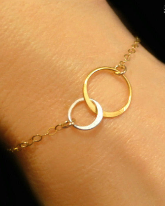 Mixed metal interlocking circle infinity bracelet 